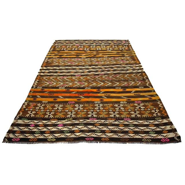 Handwoven vintage embroidered kilim rug from Kars region of Turkey. Approximately 50-60 years old. In very good condition