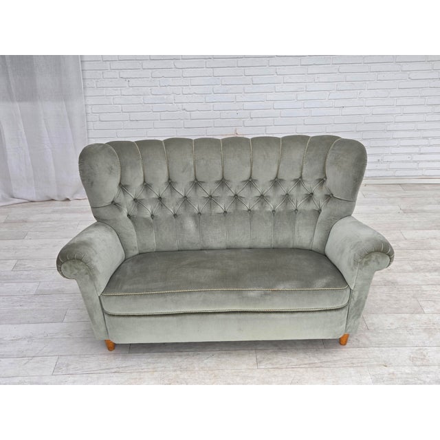 1960s, Danish 2-seater sofa. Light green furniture velour, ash wood legs, springs in the seat. Original good condition: no...