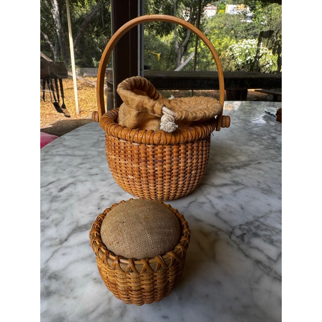 Vintage handwoven Nantucket sewing basket with movable top handle and matching pin cushion to hold needles and pins. Soft...