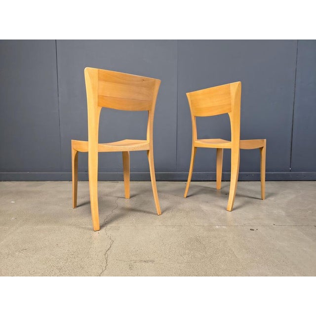 Elegant hand crafted dining chairs with beautiful curved frames. These chairs were acquired from a Belgian family of...