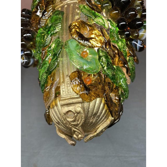 A lovely vintage Italian chandelier with richly coloured glass and a striking grape cluster design. Fitted with a single...