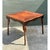 This game table showcases exceptional parquetry craftsmanship atop a naturalistic bamboo frame, its square tabletop...