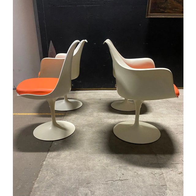 A beautiful set of four dining chairs designed by Eero Saarinen for Knoll. These chairs have been recently reupholstered...
