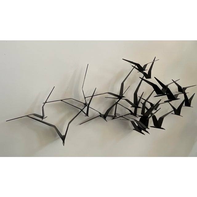 Bring the dynamic beauty of flight into your space with this stunning vintage wall sculpture by the renowned design studio...