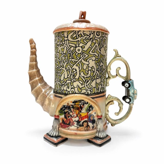 Green and White Large Tea Pot with Clothespin Lid reimagines the classic teapot with a playful twist, pairing a...