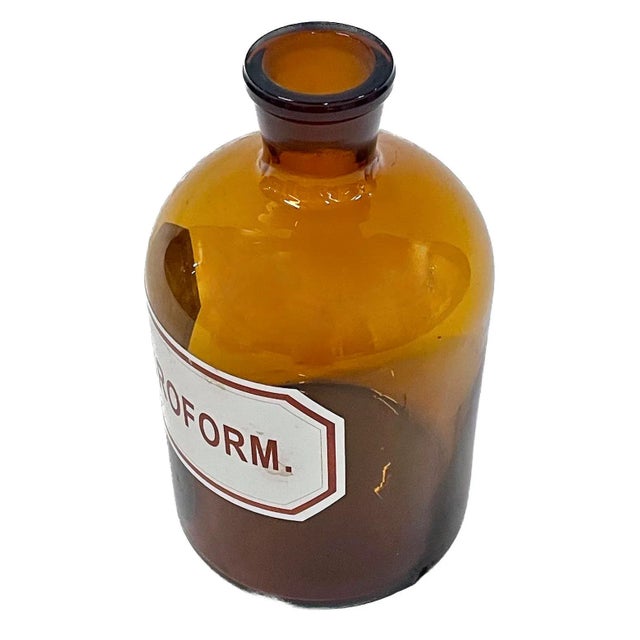 Vintage amber glass Chloroform bottle. Marked "Chloroform" on a front label.