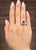 This GIA-certified sapphire and diamond cocktail ring is a bold statement of modern luxury. The deep blue of the...