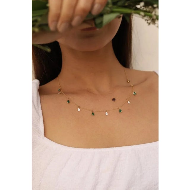 This is part of Chairish’s Fine Jewelry assortment. Emerald Necklace in 18K Gold studded with pear cut emerald pieces and...