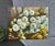 Artfully executed in oil paint on stretched canvas, this vintage floral still life painting has textured white and yellow...
