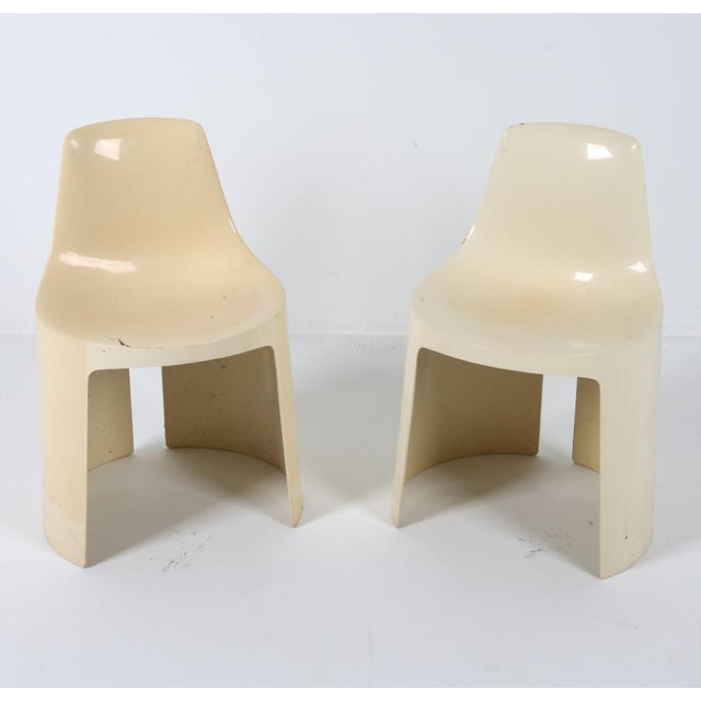 A pair of 1960's creme-colored molded molded ABS plastic chairs designed by Kay Leroy Ruggles for Directional Industries....