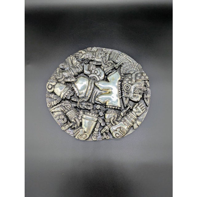 Traveling Man Treasures is selling this amazing silver-plated relief sculpture of the Aztec moon goddess Coyolxauhqui....