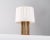 Rare table lamp in brass and teak produced in Sweden, 1950s. Up to 250V (Europe/UK Standard).The wiring of this item may...