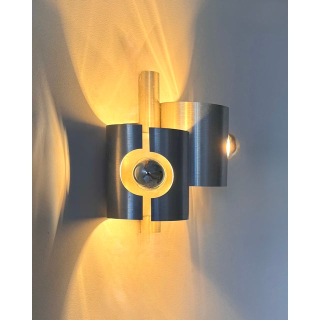 Pair of wall sconces with a brushed metal frame, produced in France in the 1970s. Timeless design, a classic example of...