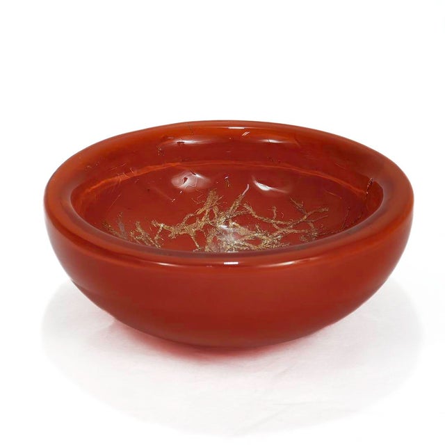 A fine mid-century modern Murano glass bowl. By Venini. Designed by Toni Zuccheri. In the form of a thick glass bowl with...