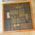 Chic, vintage Sallingboe coffee table with a geometric slate inlay top mounted in a thick teak wood frame, resting on a...