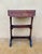 This Spanish rustic side table dates from the 20th century and is crafted in solid chestnut wood. The piece features a...