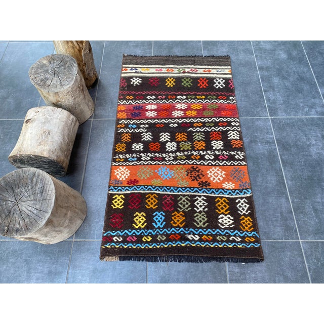 This is a vintage Turkish Oushak rug from the 1960s. The piece was hand-knotted.