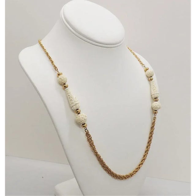 Vintage 1970s Signed Crown Trifari Carved Faux-Ivory Sautoir Necklace For Sale - Image 9 of 9