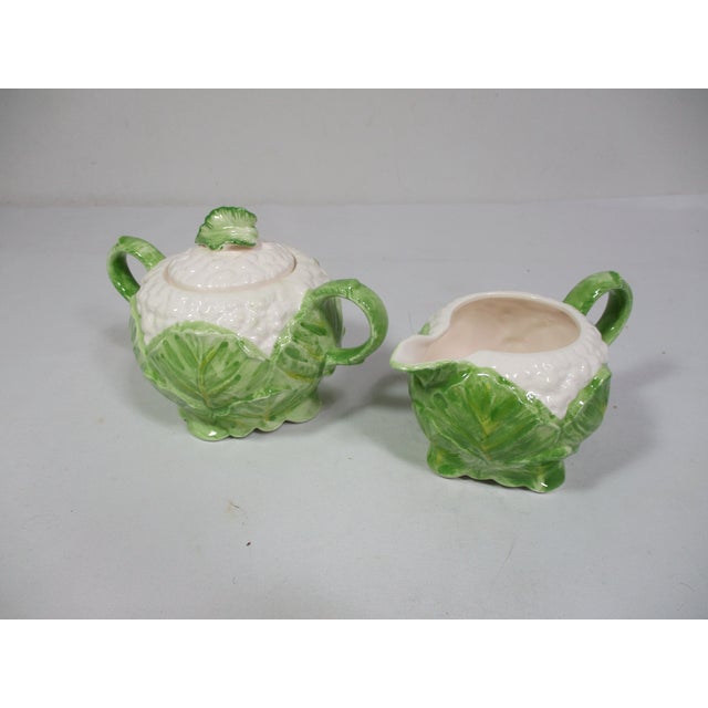A vintage Fitz & Floyd ceramic vegetable themed sugar bowl and creamer in the form of Cauliflowers. They are hand- painted...
