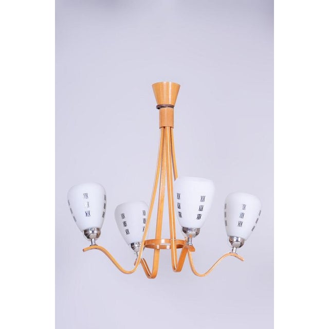 Maker: Dřevotvar Humpolec This stylish and highly elegant four-arm chandelier, originating from the 1960s from...