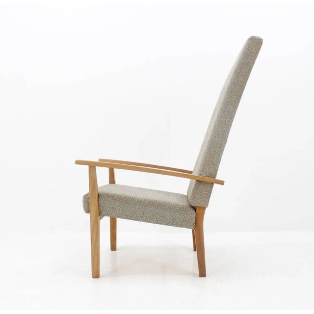 The fabric upholstery probably made by Antonin Kybal. This piece is attributed to the mentioned designer/maker. It has no...