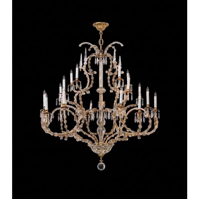 the impressively-sized classically-styled chandelier featuring a gilt-iron multi-tiered cage-form frame; the whole adorned...