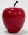 Bright red marble vintage apple paper weight with rubber stem. Age wear. No chips.