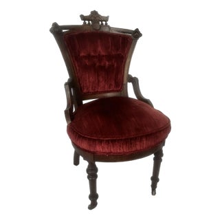 Antique Victorian-Style Parlor Chair Featuring Rich Red Velvet Tufted Upholstery For Sale