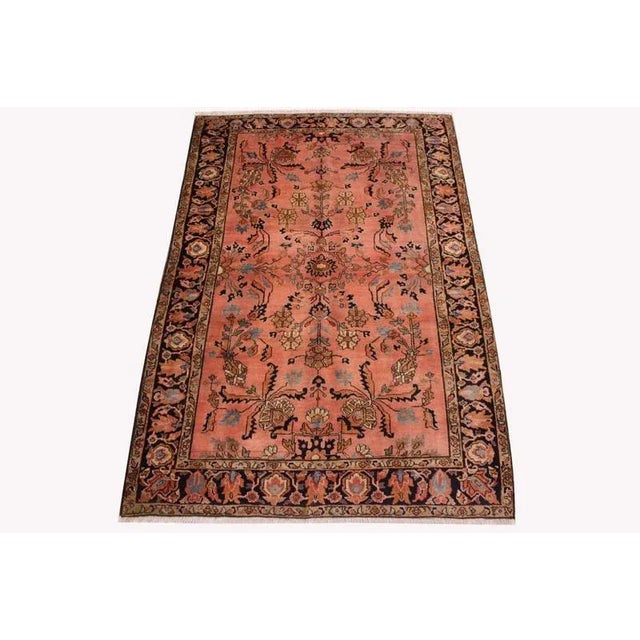 Antique Middle Eastern Sarouk rug | Knot density: High | Pattern: Colorful leaf and floral motifs | Size: 197×127 cm |...