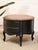 This vintage occasional table pairs a black base with a burlwood top, creating a strong contrast between the dark...
