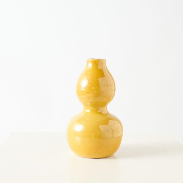 Yellow-Glazed Vase in Double-Gourd Form China A vase in double-gourd form with a rich yellow glaze. Marked on base. Height...