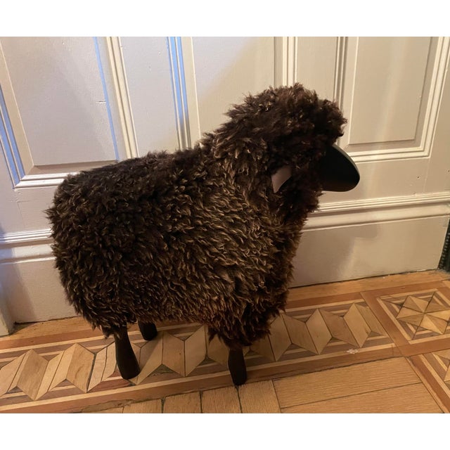 Lalanne style black wood sheep with leather ears and black and brown sheepskin.