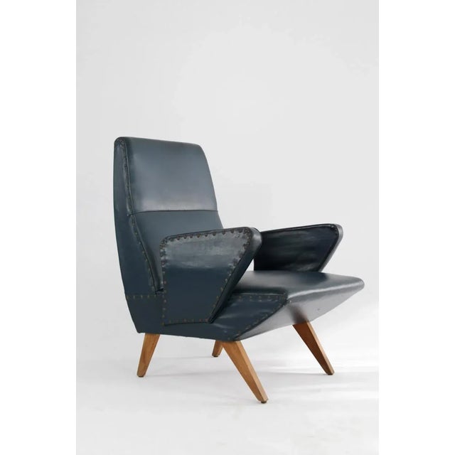 This pair of Italian armchairs was designed by Nino Zoncada in the 1950s. They have armrests and have been reupholstered...