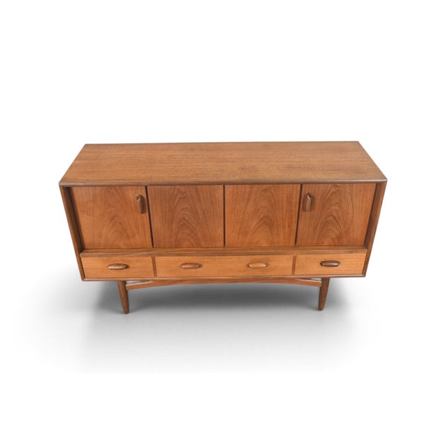 This credenza is from G Plan's Scandinavian Range, designed by Victor B. Wilkins and produced in England in 1964. The teak...
