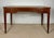 Elegant early 20th century writing desk crafted in hardwood and inspired by the refined lines of the Louis XVI period. The...