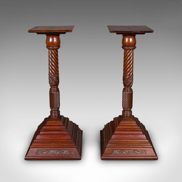 This is a pair of large antique torchiere. An English, mahogany country house bust stand or jardiniere pedestal, dating to...
