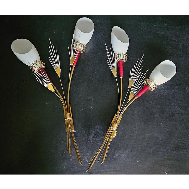 Pair of wall lights with 2 arms of light model “muguet” from the famous maison lunel. Structure in gilded brass, lacquered...