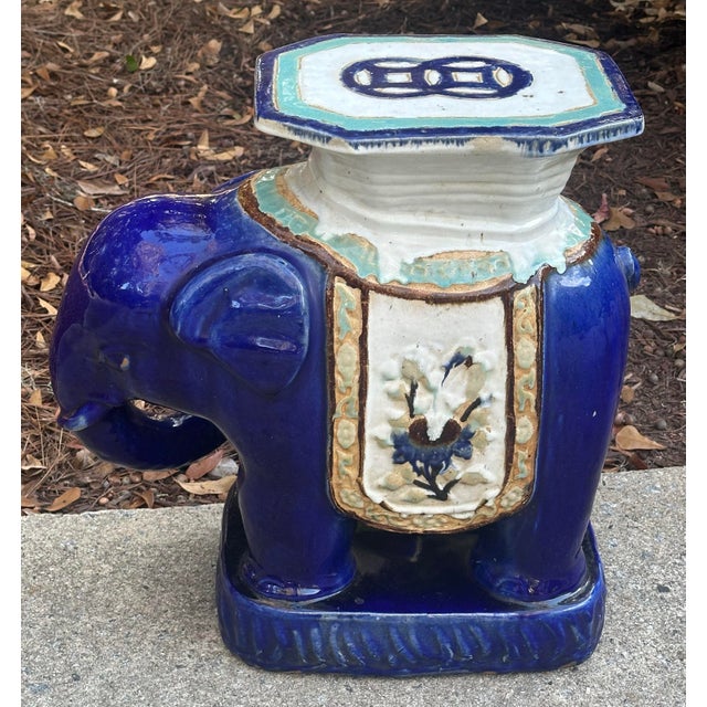 Hand painted antique glazed ceramic elephant used outside or indoors as a decorative side table or stool. Wonderful...