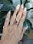 This elegant Tourmaline ring features a vibrant 3.7ct pear-cut rubellite tourmaline measuring 13x8mm, set in solid 14K...