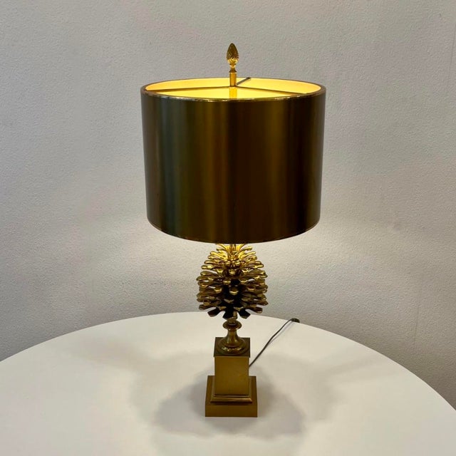 Beautiful table lamp with brass shade and gilt bronze pine cone base, made by Maison Charles in Paris around 1970. Signed...