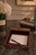 Gucci desk tray dating to the 1970s, covered in deep red leather and accented with gold-toned metal hardware. The...