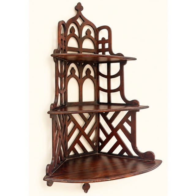 Elevate an empty corner with this stunning vintage Chinoiserie-style corner wall shelf. Crafted from rich, dark mahogany...