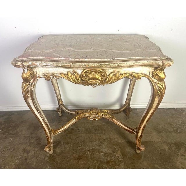 19th Century French Rococo style white colored painted & parcel gilt table. The Rococo style flourished in Europe,...