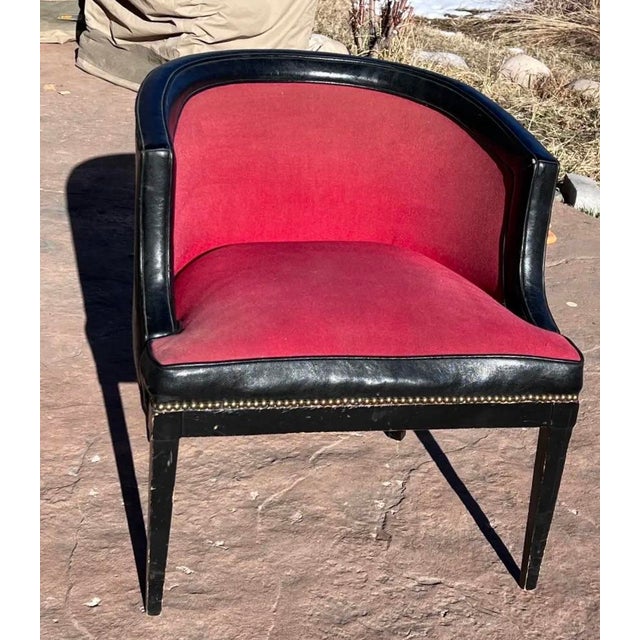 Vintage 1960's leather club chair; black leather trim and on arms and back, red plush velvet on seat and front, brass...