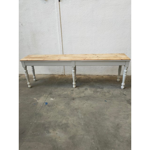 : Tailor's table, used for cutting fabrics for dressmaking, made of beech wood, 1970s. Dimensions: 93cm high, 303cm long,...