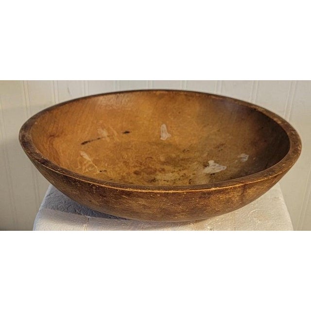 This is a hand carved or turned butter bowl.The condition is very good.