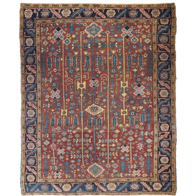 Antique Heriz Rug 9'1'' x 11'2''. The natural madder red field of this moderately woven NW Persian village carpet shows a...