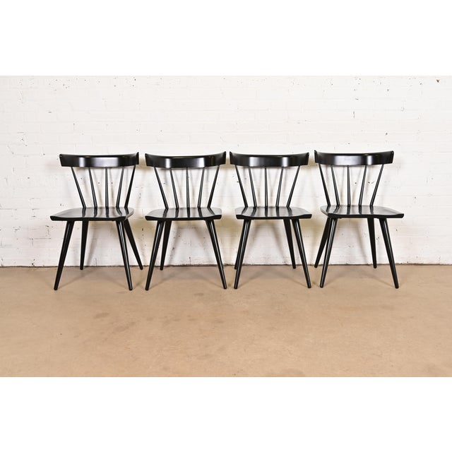 An exceptional set of four iconic mid-century modern spindle back dining chairs By Paul McCobb for Winchendon Furniture,...