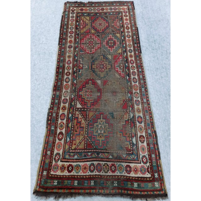 Origin: Caucasian Material: wool pile on wool foundation Pattern: geometric Style: nomadic/tribal Circa: 1920's