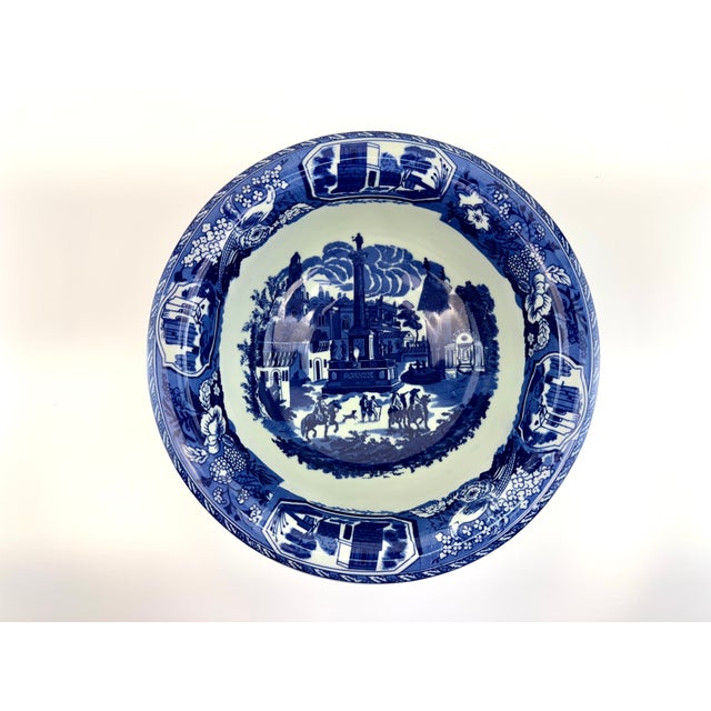 Antique Staffordshire blue and white transferware bowl featuring a detailed romantic landscape with figures, architecture,...